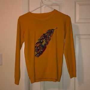 Cashmere mustard yellow sweater with hand sewn feather and Pearl embellishments